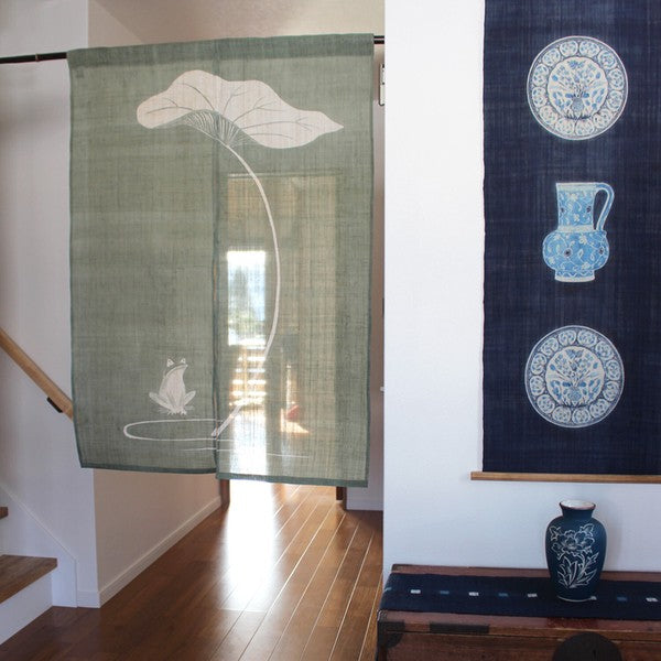 Hemp noren curtain hanging in doorway, allowing light and air to flow through