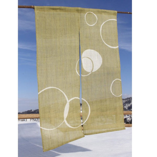Hand-woven hemp noren curtain in traditional Japanese pattern, hanging outdoors with natural light.