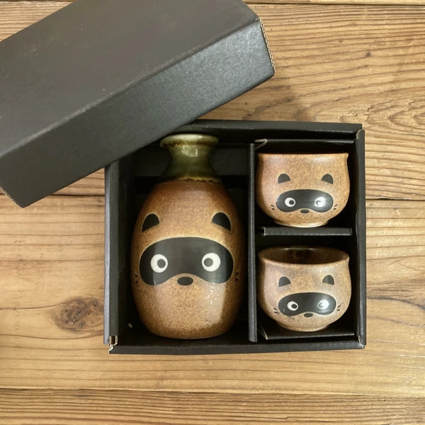 Tanuki sake set presented in a decorative gift box with fitted compartments for bottle and cups