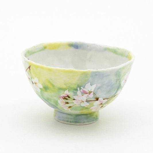 Green sakura rice bowl with lifelike cherry blossom motif, crafted from smooth porcelain