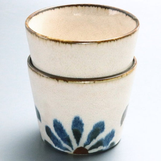 Two Yachimun-style ceramic cups stacked together, showcasing their thickness and bold indigo and brown patterns