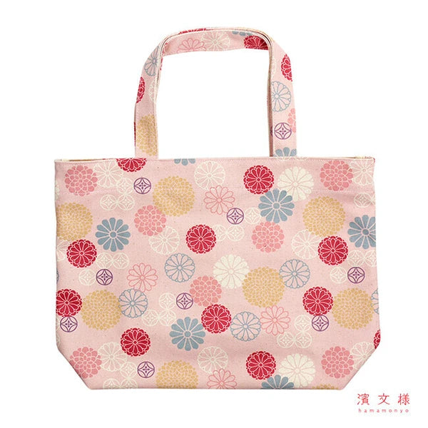 Close-up of Hamamonyo pink canvas tote showing floral chrysanthemum and shippō motifs on durable cotton fabric