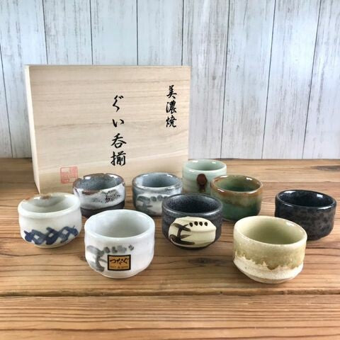 Variety of colors and textures on Mino yaki sake cups. Presented with wooden gift box.