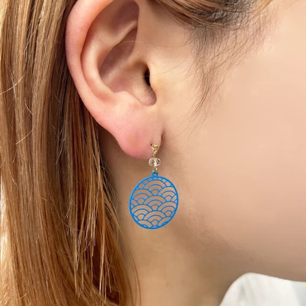Blue Seigaiha resin earrings styled on model