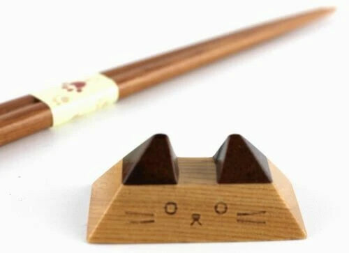 Close-up of minimalist cat-face chopstick rest with perky ears