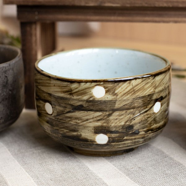 Rustic Polka Dot Minoware matcha bowl with aged dark glaze and subtle white dots, reflecting wabi-sabi aesthetics