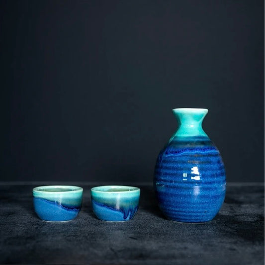 Mino ware sake set with turquoise and indigo gradient glaze, including tokkuri and cups