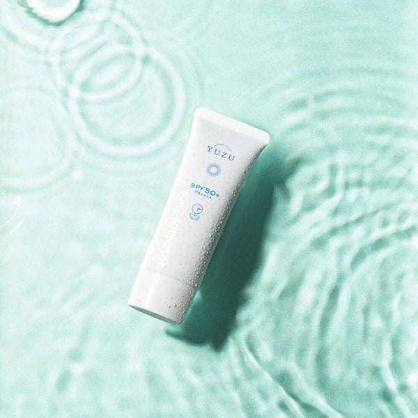 Applying Yuzu UV Gel onto back of hand showcasing smooth, watery texture