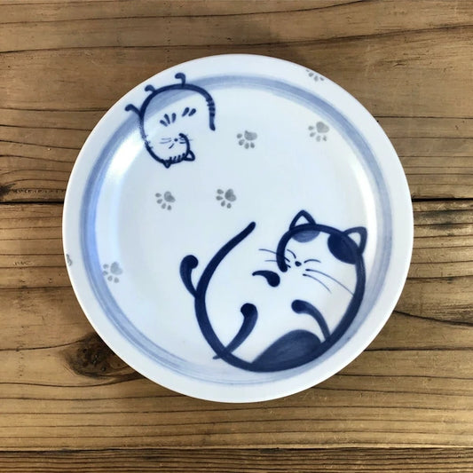 Rolled Cat ceramic plate featuring a relaxed cat in indigo hues, made in Japan