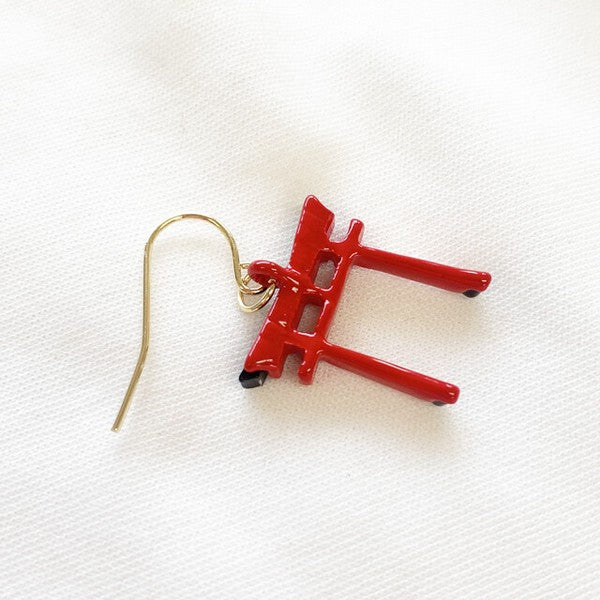 Back side of Japanese torii gate earrings highlighting layered resin design