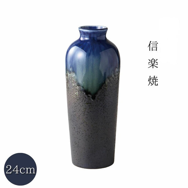 Close-up of handcrafted Shigaraki vase showing textured blue kiln glaze