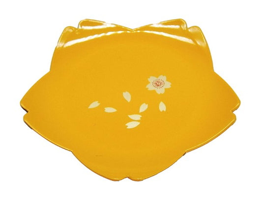 Close-up of cherry blossom motif on yellow flower-shaped dessert plate