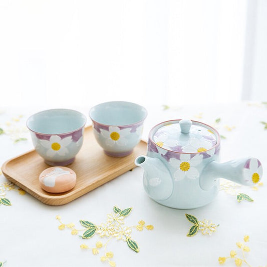 Hasami ware tea set with teapot and two sencha cups featuring raised floral design in elegant pastel tones