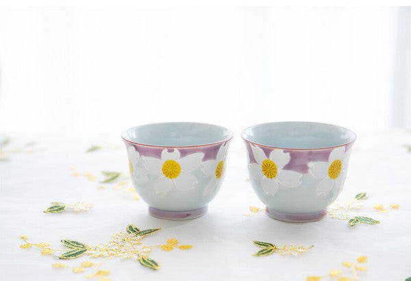 Hasami ware teacups set with delicate raised flower pattern and smooth rounded form
