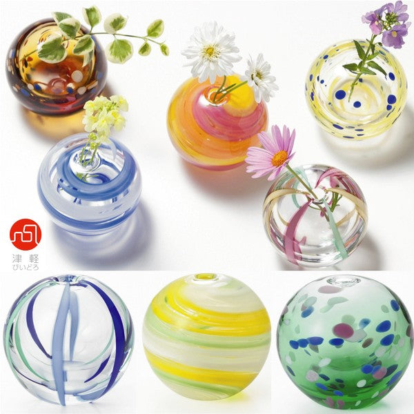 Collection of colorful Tsugaru Vidro single-flower vases, each showcasing unique seasonal colors and handblown glass craftsmanship