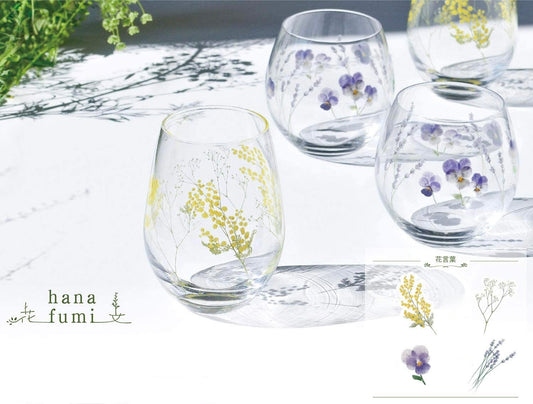 Floral glass collection featuring mimosa, lily of the valley, lavender, cherry blossom, poppy, and nemophila designs
