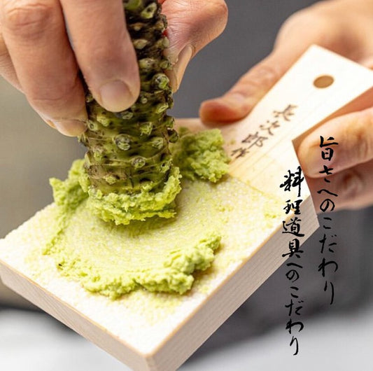 Sharkskin grater in use, preparing fresh wasabi paste with creamy consistency