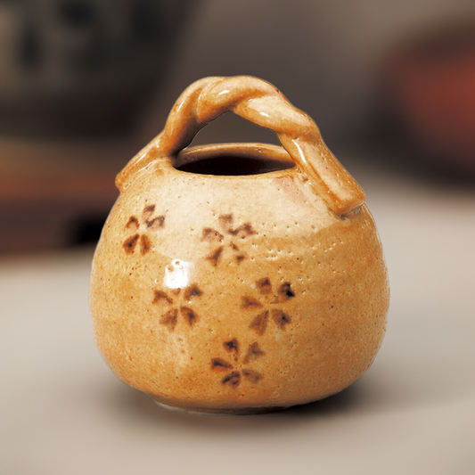Akashino Sakura ceramic vase with twisted handle and Shino glaze