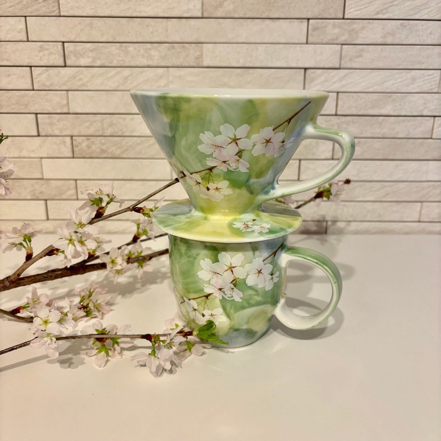 Sakura Blossom coffee dripper in fresh green with matching mug, adorned with cherry blossom design