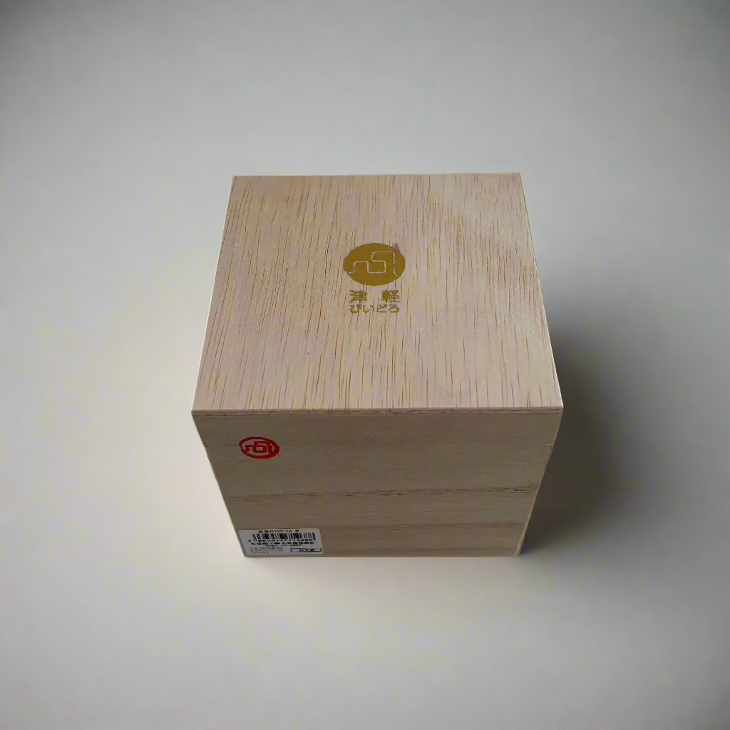 Wooden box with engraved design on a white background