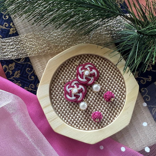 Handcrafted silk-wrapped pink mizuhiki earrings in traditional Japanese knot design
