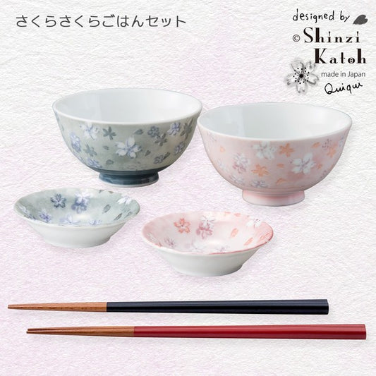 Sakura-themed gift set with two rice bowls, two small plates, and two pairs of chopsticks arranged