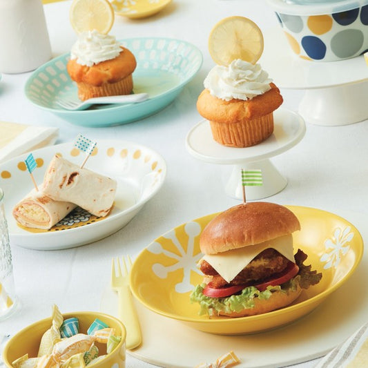 Nordic textile pattern plates styled with cakes and burgers on dining table