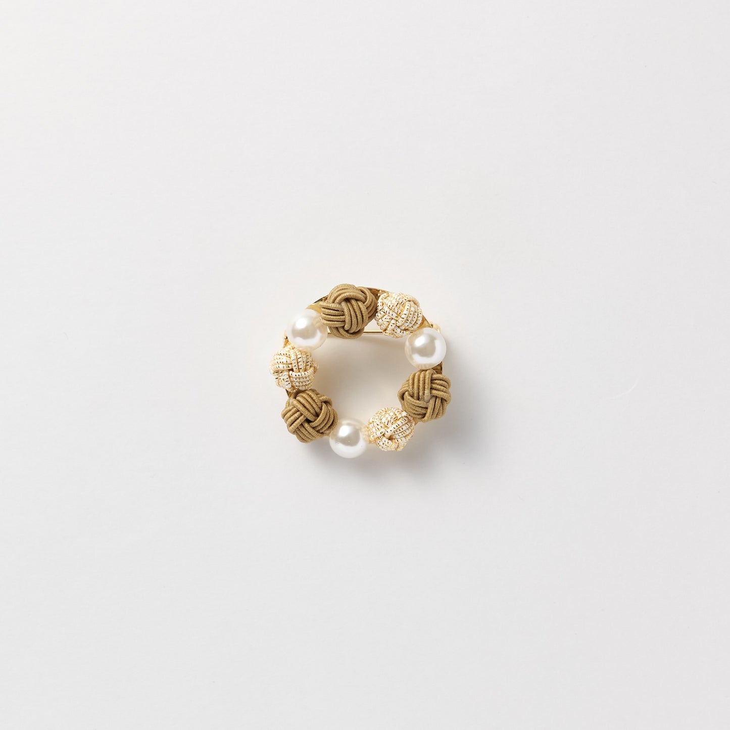 Elegant black pearl and mizuhiki brooch symbolizing connection and good wishes