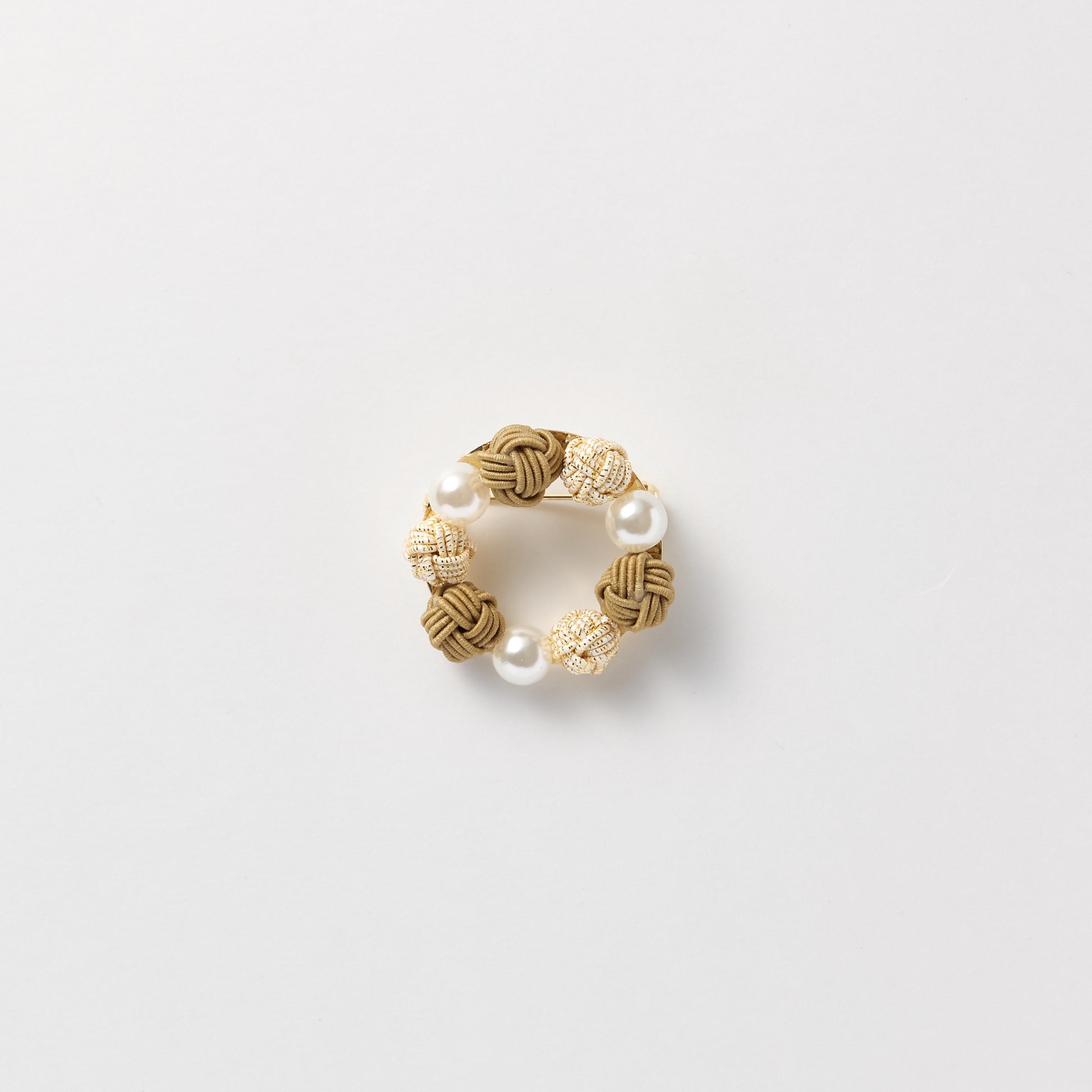 Elegant black pearl and mizuhiki brooch symbolizing connection and good wishes