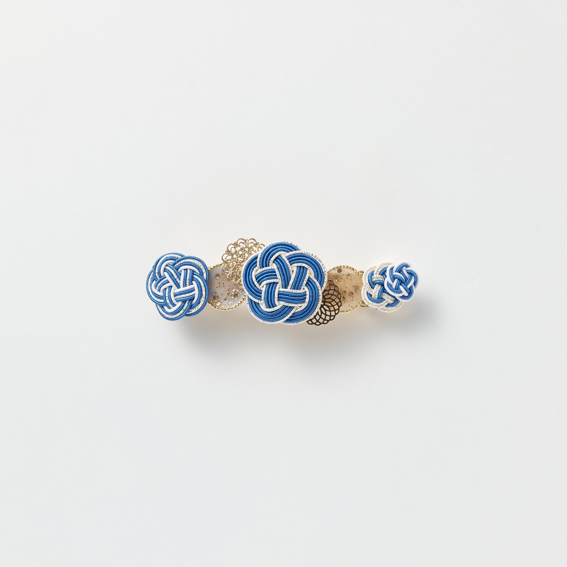 Front view of handmade Plum Blossom Knot Barrette in blue, featuring silk-wrapped mizuhiki knot