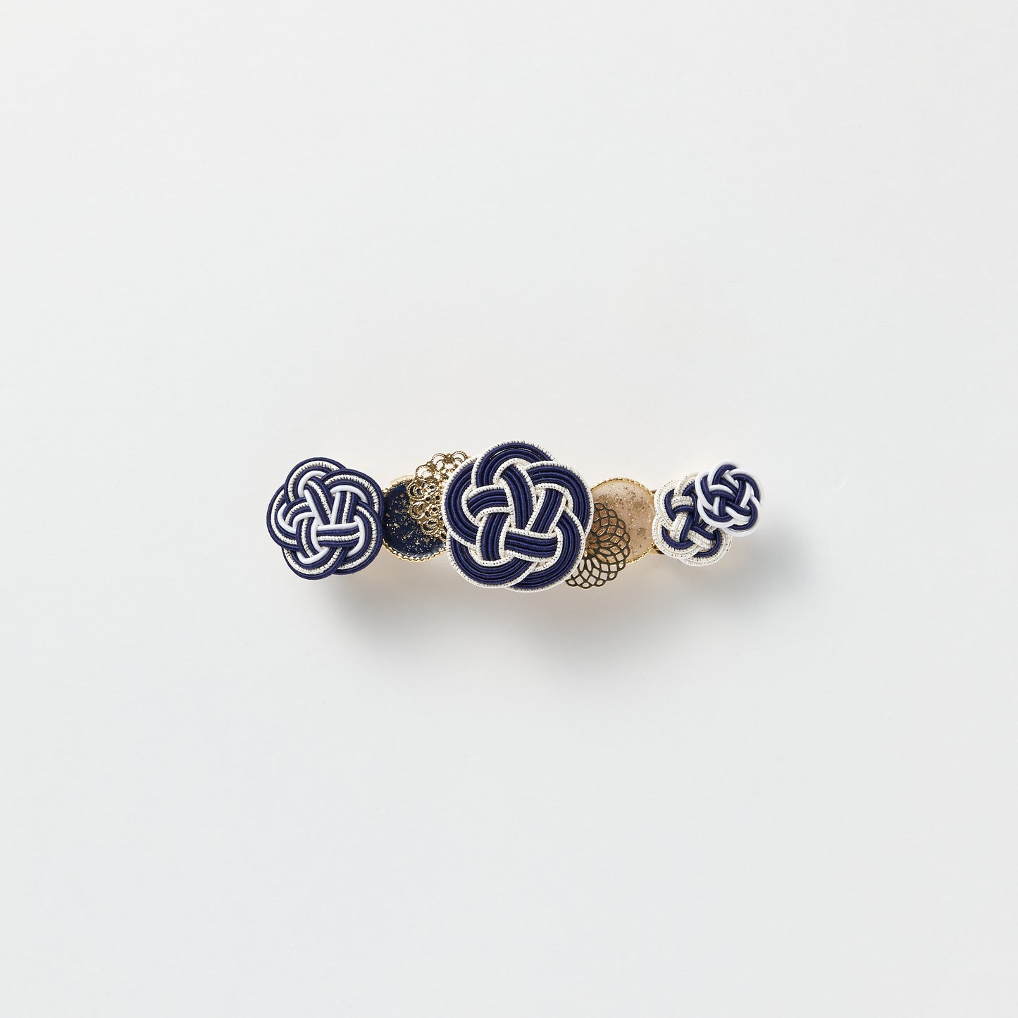 Front view of handmade Plum Blossom Knot Barrette in navy, featuring silk-wrapped mizuhiki knot
