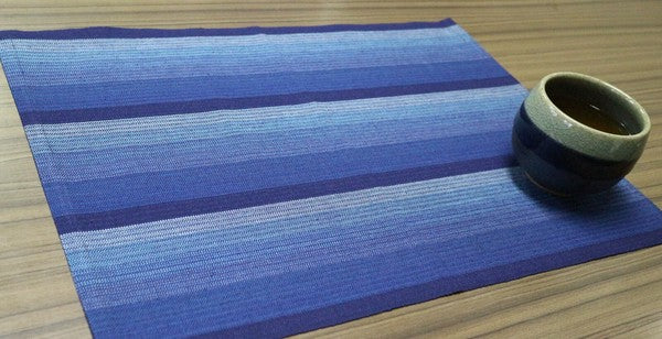 Close-up of Awa Shijira fabric texture in navy indigo stripe pattern