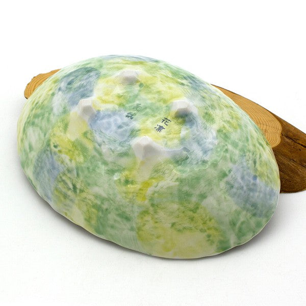 Bottom view of Sakura Blossom oval serving bowl with branding