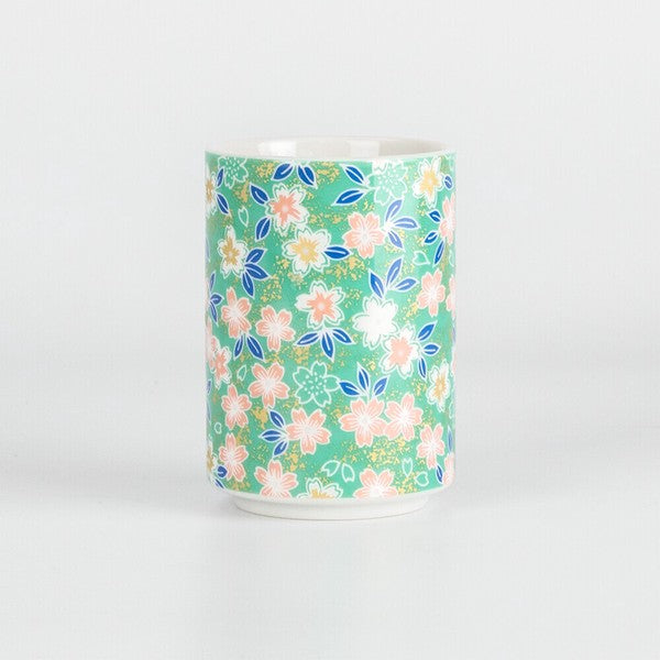Kyoto style Japanese tea cup with delicate floral and linear patterns