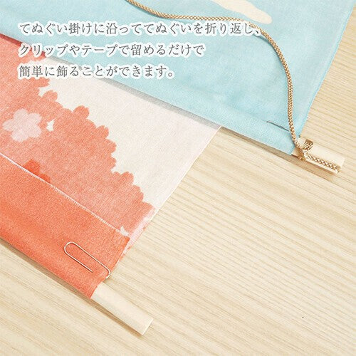 Japanese tenugui displayed with wooden wall hanger, easy clip-on installation