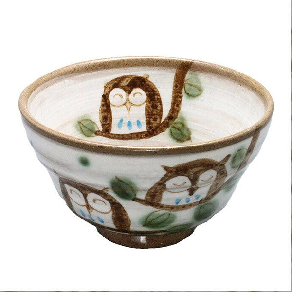 Minoware rice bowl with hand-painted owl design, featuring a gentle earthenware texture and whimsical charm