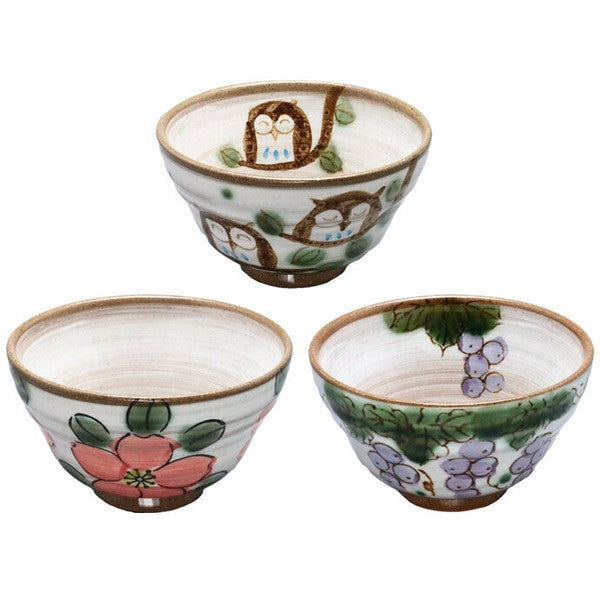 op view of hand-painted rice bowl showing interior illustration and rounded shape.