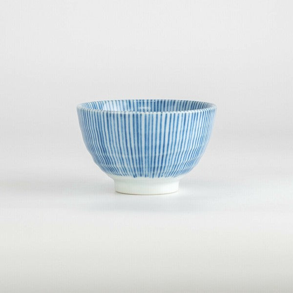Side angle of Japanese porcelain teacup featuring traditional blue stripe pattern