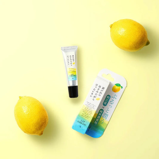 Setouchi Lemon Lip Balm with fresh lemons in the background, highlighting its natural citrus ingredients