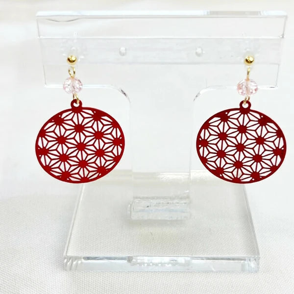 Front view of red geometric hemp leaf pattern earrings