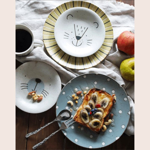 Playful seal and hedgehog plates styled with snacks and desserts