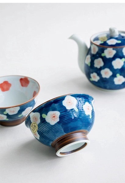 Close-up of Arita Ware tea cups decorated with blue plum blossoms