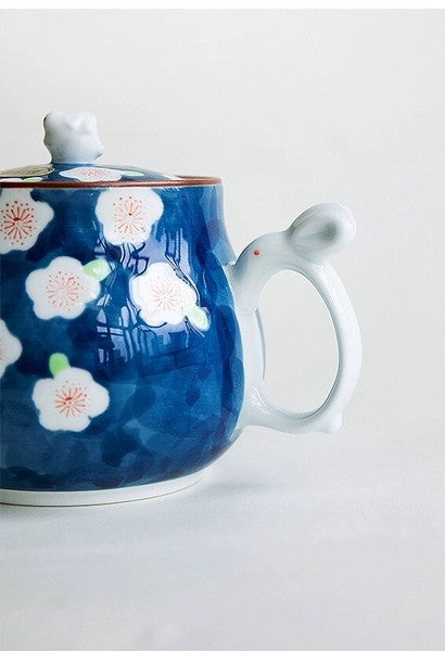 Close-up of the bunny-shaped handle and plum blossom design on Arita Ware teapot