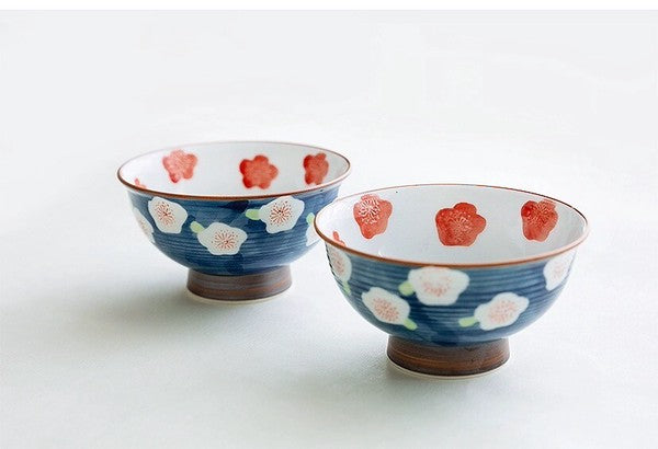 Two Arita Ware Japanese tea cups with deep blue plum blossom pattern