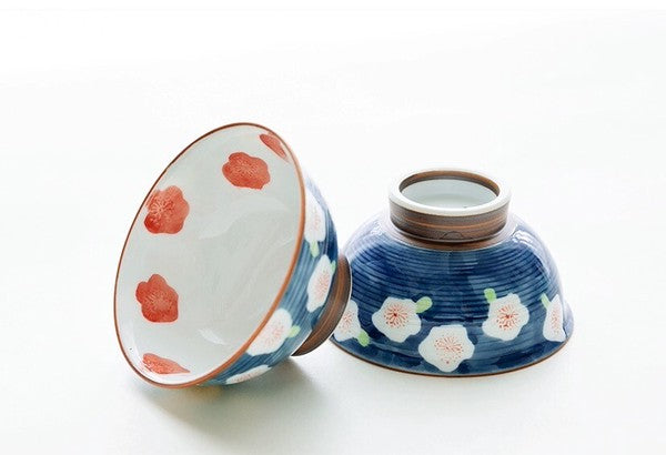 Two Arita Ware Japanese tea cups with deep blue plum blossom pattern