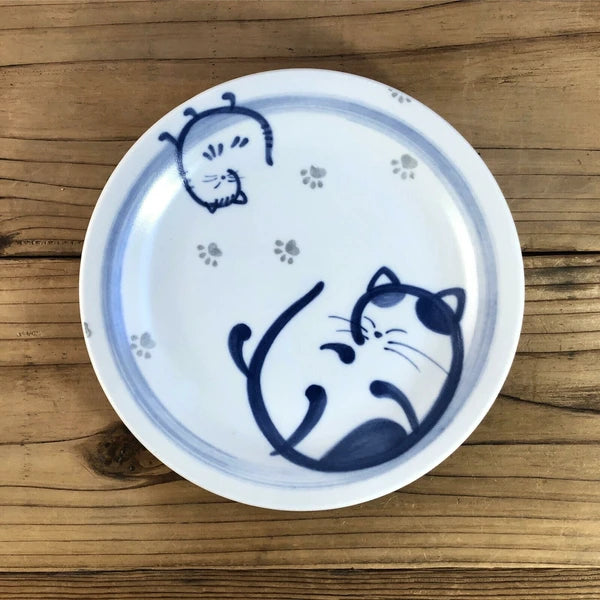 Rolled Cat ceramic plate featuring a relaxed cat in indigo hues, made in Japan
