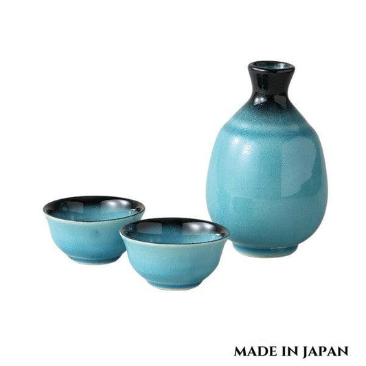 Glossy Mino ware sake set in vibrant Turkish blue glaze, with rounded carafe and two cups