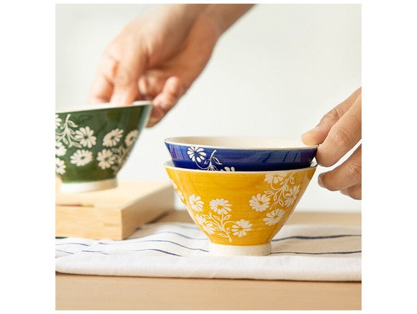 Handcrafted Japanese ceramic rice bowl with delicate floral design