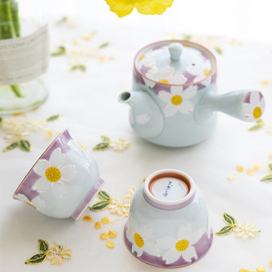Japanese Hasami ware floral tea set with teapot and two cups in soft blue and purple with hand-painted white flowers