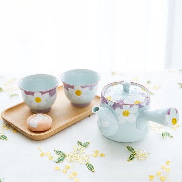 Hasami ware tea set with teapot and two sencha cups featuring raised floral design in elegant pastel tones